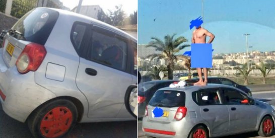 احتجاج على الطريقة الجزائرية بسبب مخالفة مرورية مخبول يتعرّى بشكل كامل ويصعد فوق سيارته في الشارع!